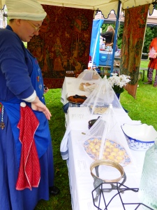 The incredible vigil food, based on 16th-century recipes, and most ably managed my Master Gille MacDonhuill. In the foreground, another amazing cook, Liz (whose SCA name, I confess to not knowing...apologies!)