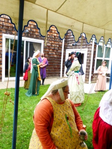 Her Majesty, Queen Gabrielle (in background on the left, dressed in green), with Lady Mairin O'Cadlah (background, on the right, dressed in light green) and Lady Elyes la Bref (foreground) 